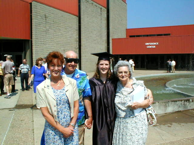 The day Crissy graduated from Marshall University I was in Kenya so Kathy went in my stead, there's my Dad then Crissy and Mom there too.